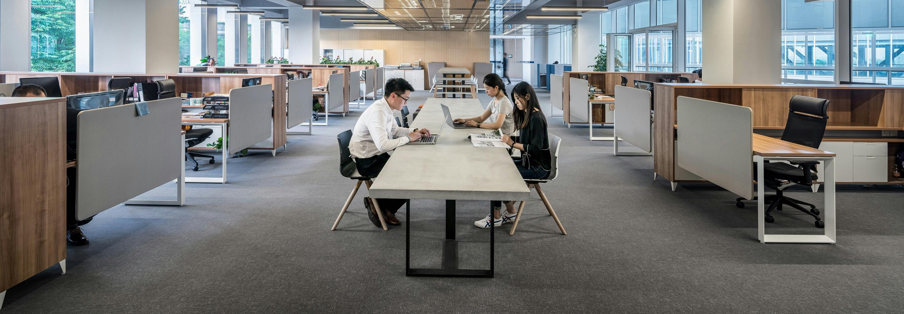 A meeting room with people working