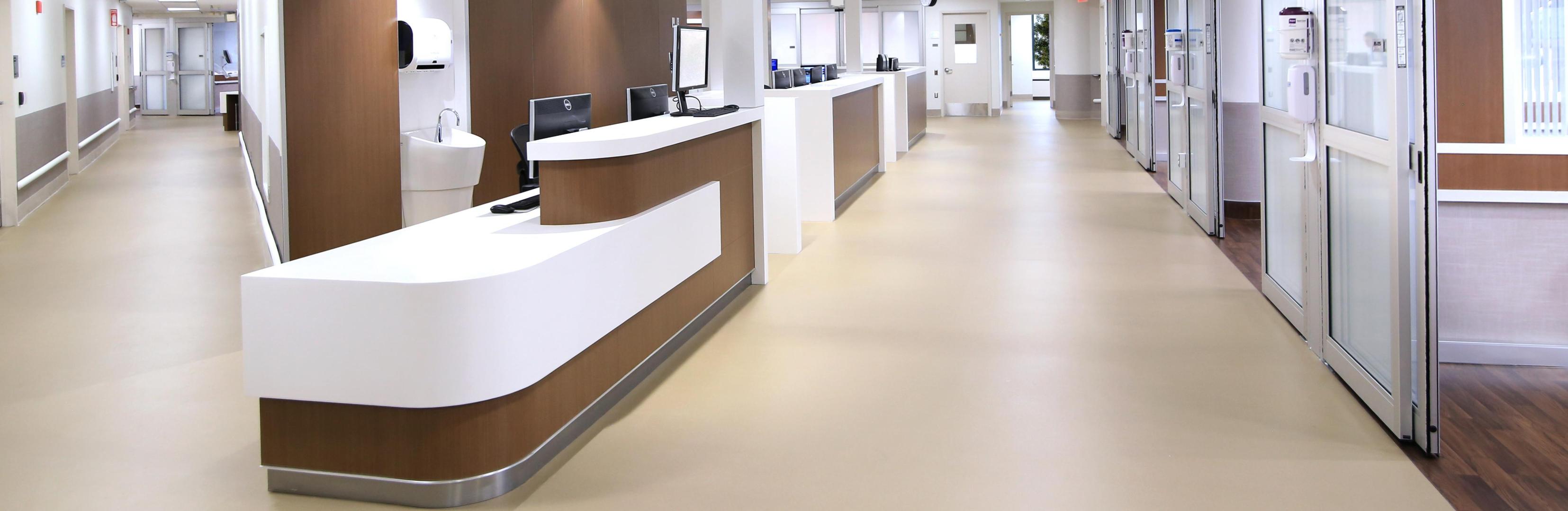 A shot of a healthcare facility hallway and desk