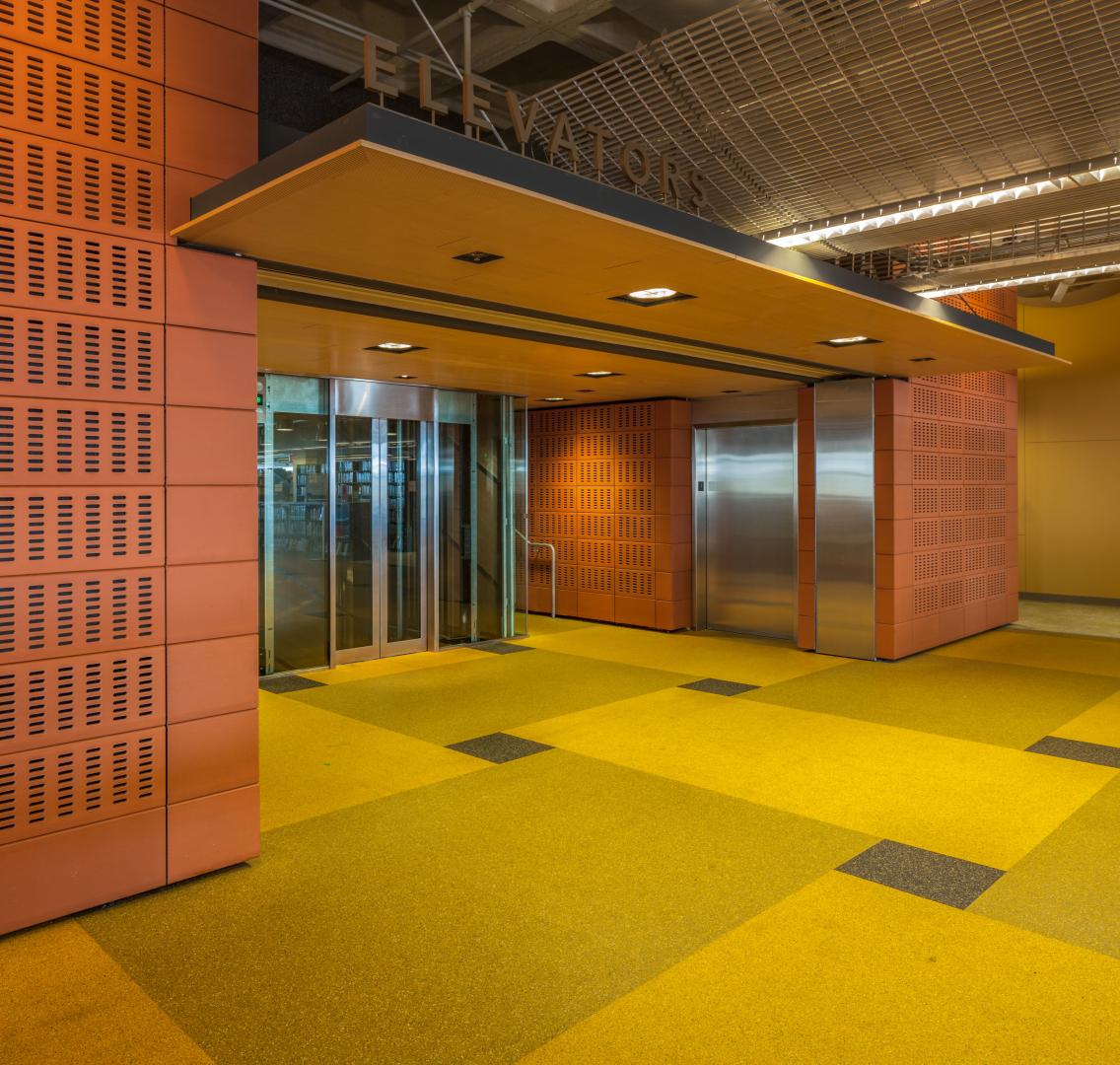 a shot of an elevator with ECOsurfaces floor outside of it