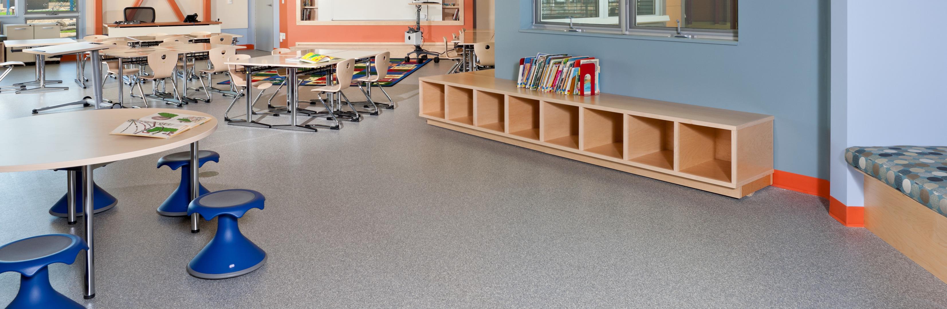 A bright and colorful classroom in a school with ECOsurfaces Classic flooring