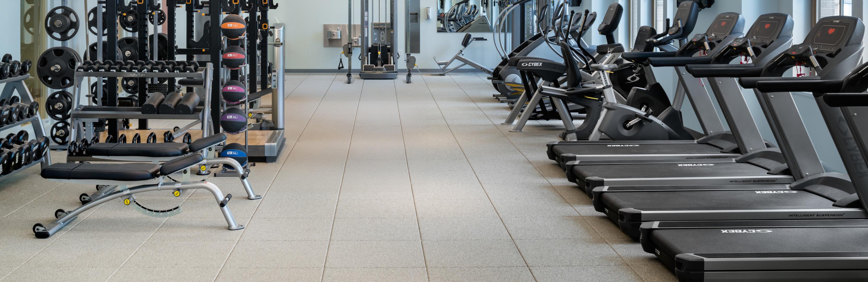A fitness center in a hotel with ECOsurfaces flooring installed