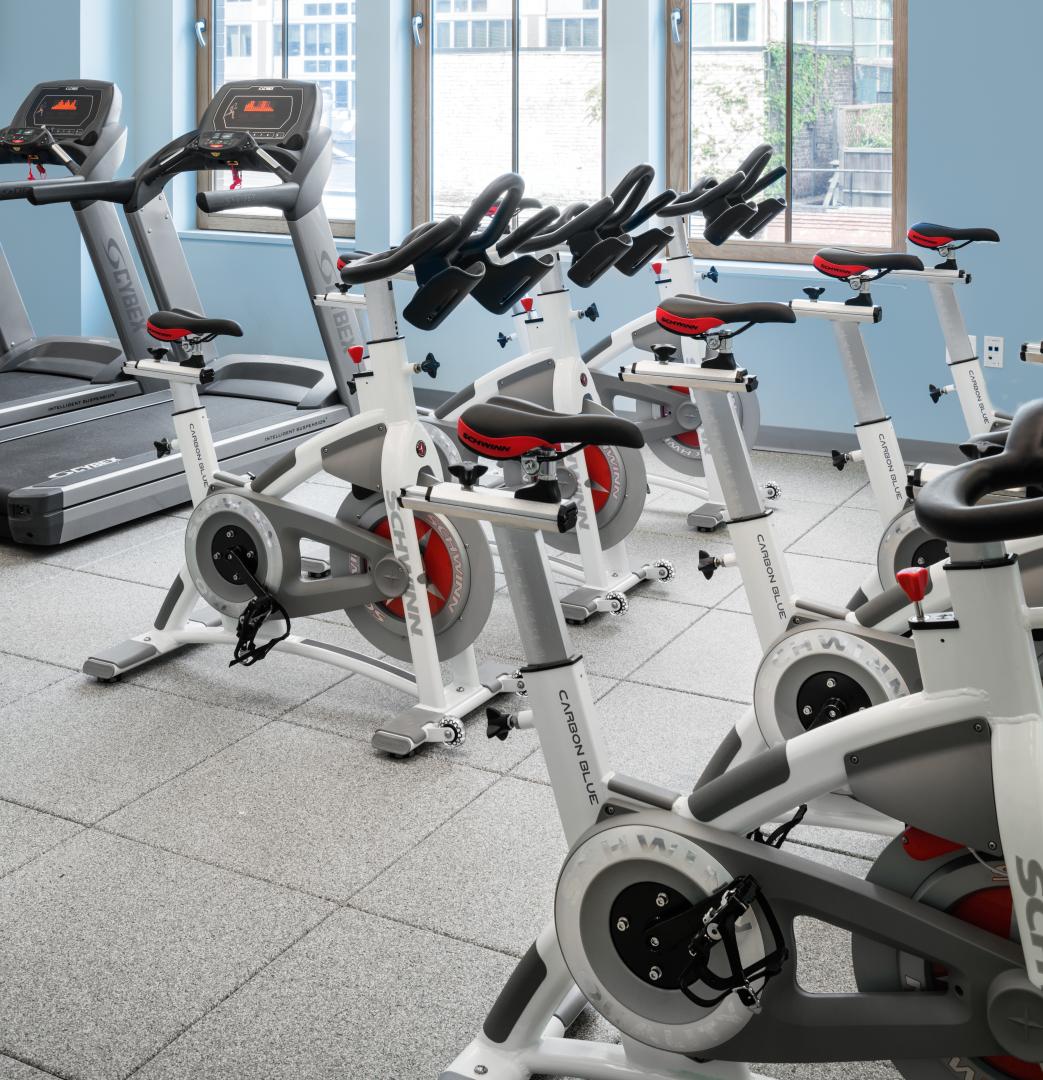 A fitness center with cardio equipment